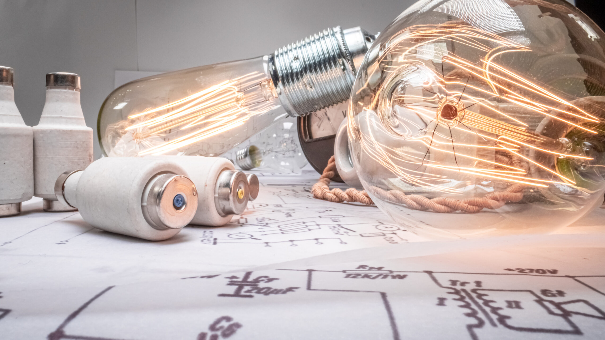Edison light bulb with cables, fuses, diagrams. Old fashioned crafts.