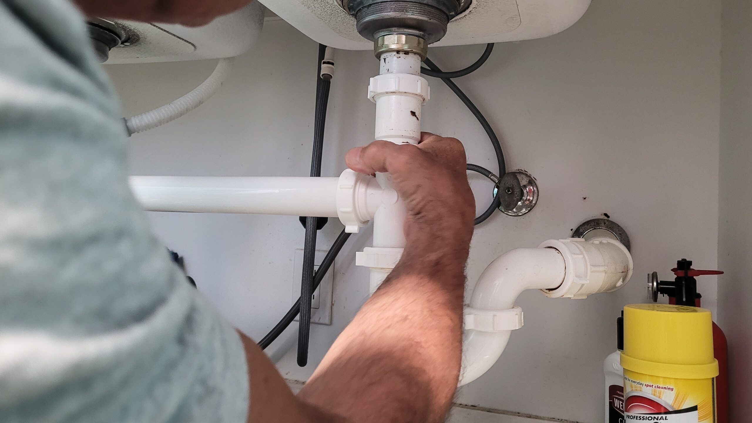 handyman-at-home-tightening-seals-on-plumbing-pipe-2023-11-27-05-11-26-utc
