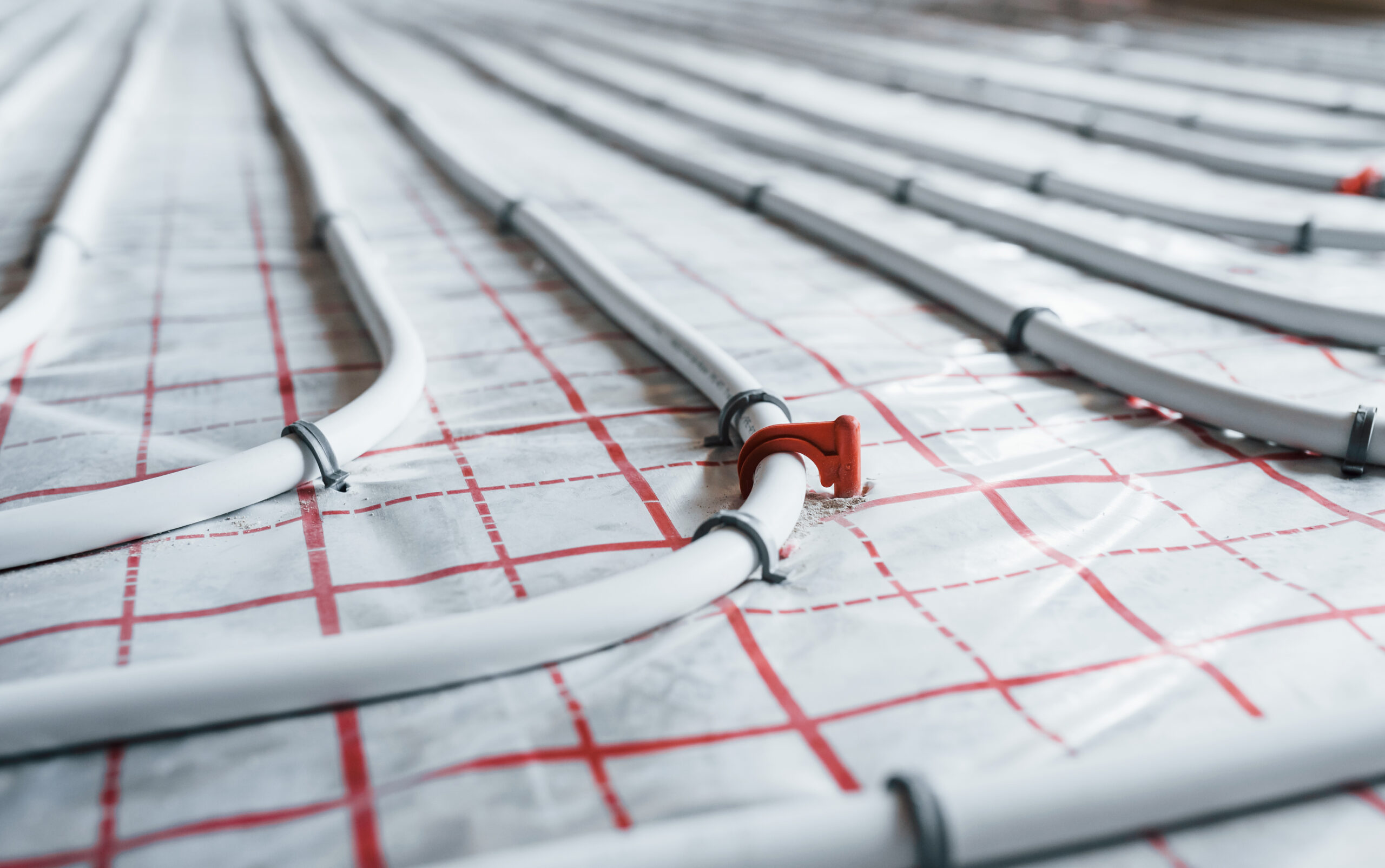 Pipes of underfloor heating system. Close up view. No people.